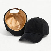 The Silk-Lined Cotton Twill Hat in Black, exterior and silk-lined interior