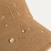 The Silk-Lined Hat in Camel, water-resistant suede detail